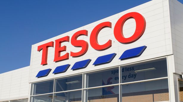 Front entrance sign of a Tesco Superstore supermarket