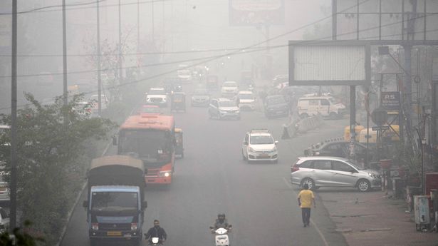 Commuters drive through a thick layer of smog as air pollution shoots up in New Delhi, India, Monday, Nov. 18, 2024. (AP Photo/Manish Swarup)