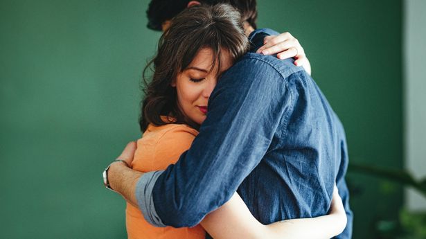 Woman and man embracing