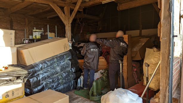 German police and National Crime Agency (NCA) investigators at a storage facility in Germany