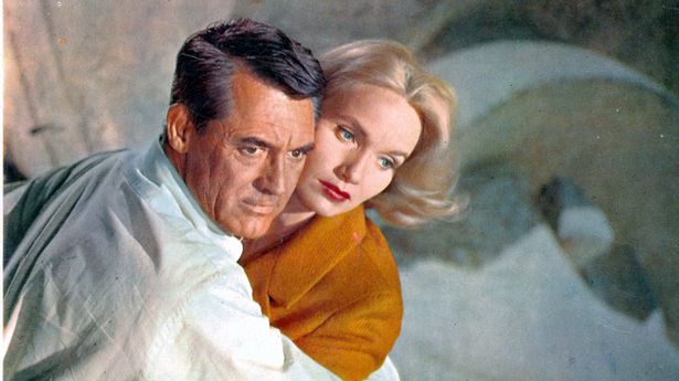 Cary Grant holding Eva Marie Saint in a scene from the film 'North By Northwest'