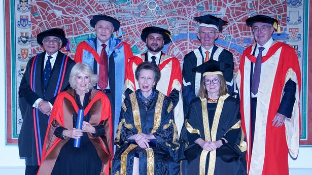 he Queen poses with the Princess Royal, Professor Wendy Thomson CBE, (left to right back row) Abdul Fazal Bhanji OBE, Anthony Neoh, Dr Nahim Ahmed MBE, Sir Mark Lowcock, and Professor Sir Michael Arthur