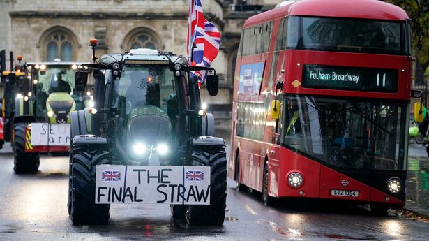 Farmers drive around Parliament Square ahead of a protest at inheritance tax changes